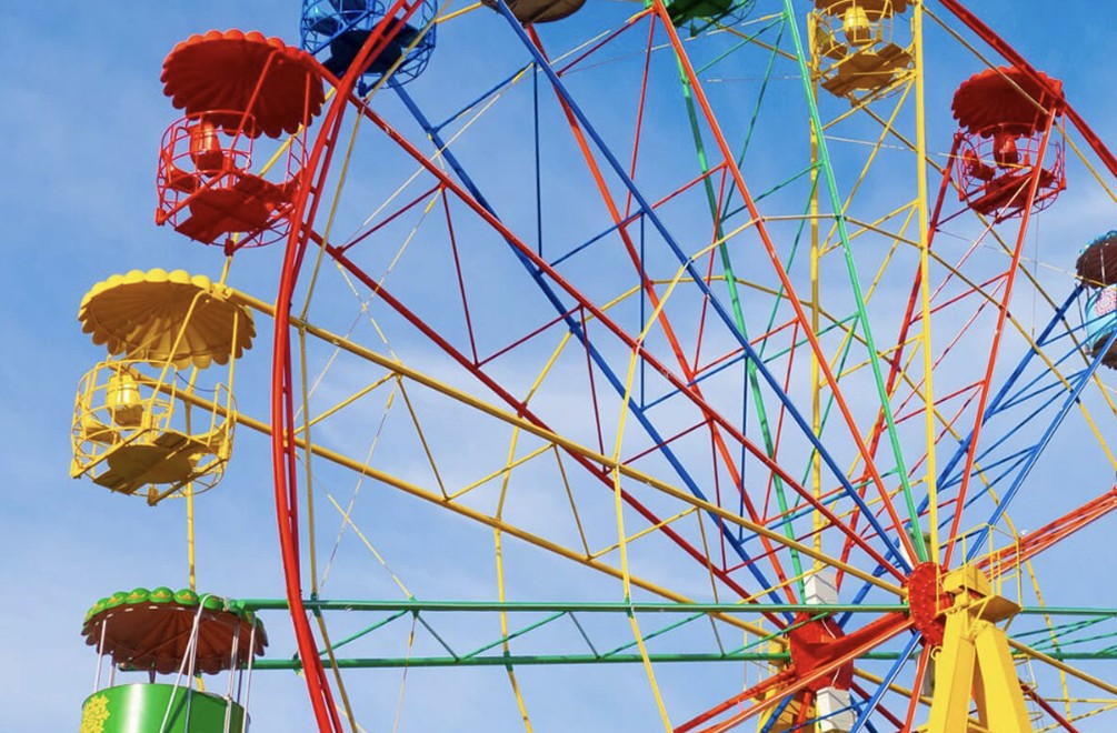 Bright Ferris wheel with red, yellow, and blue gondolas