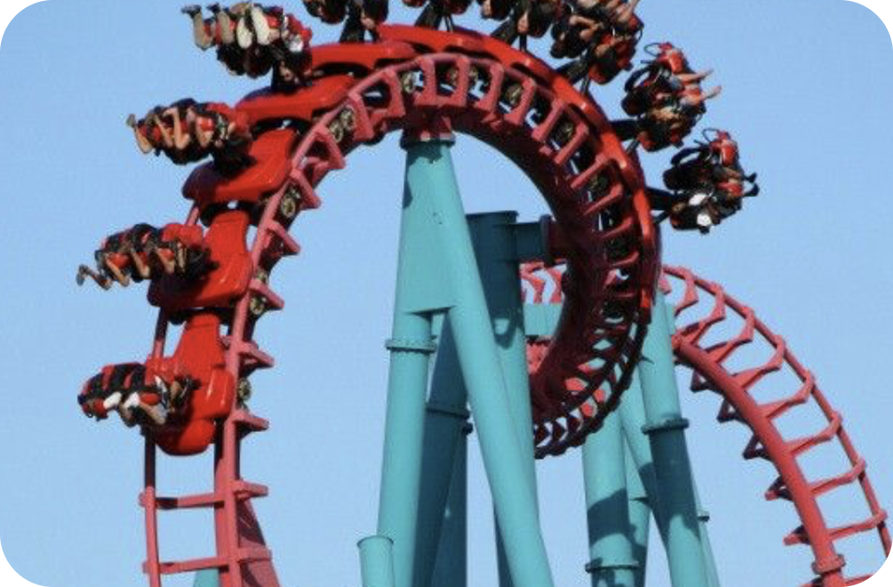 Roller coaster loop with riders in motion